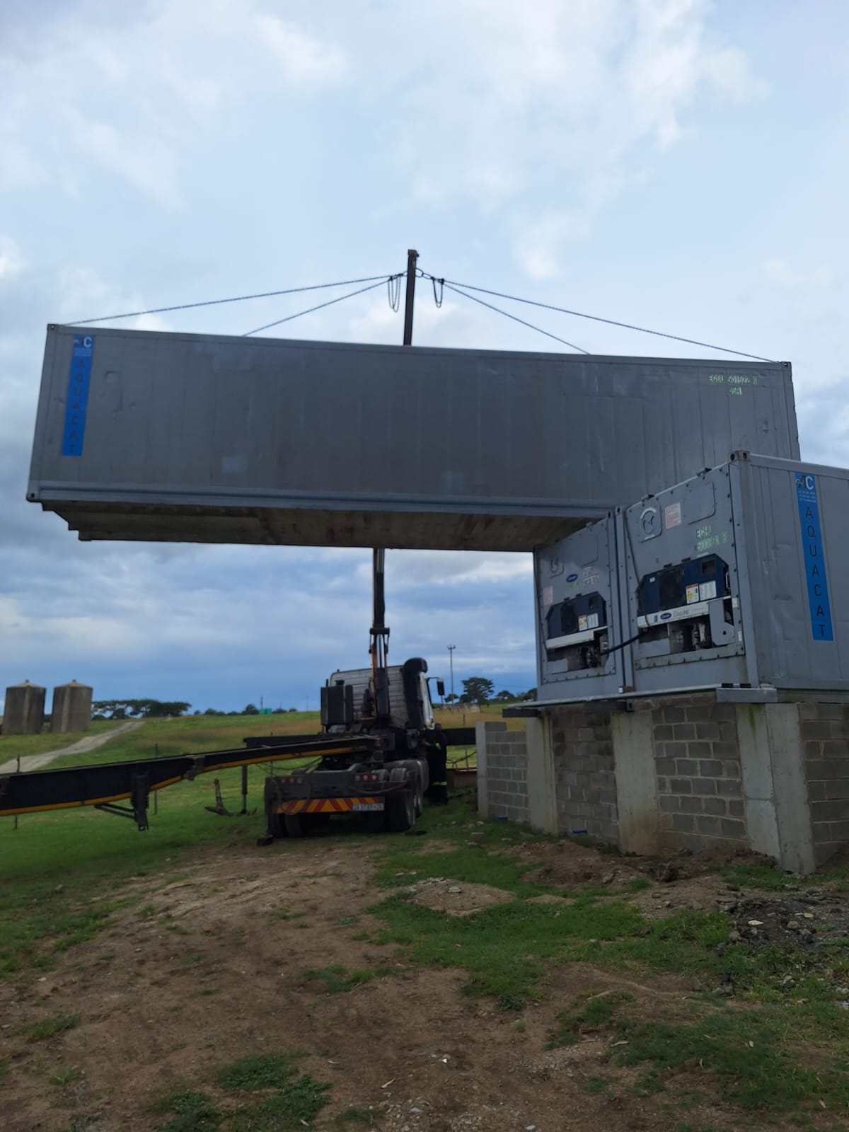 AquaCat reefer being crane-lifted into position